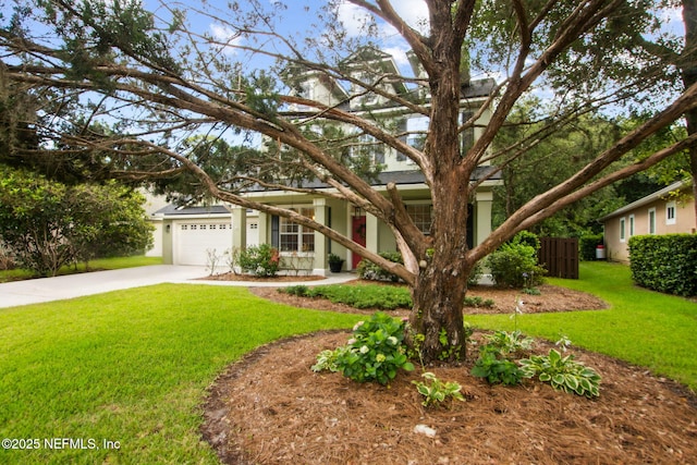 85488 Sagaponack Dr, Fernandina Beach, FL 32034 - view of front of property featuring concrete driveway, a garage, and stucco siding