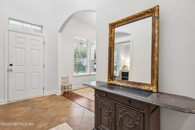 85488 Sagaponack Dr, Fernandina Beach, FL 32034 - foyer featuring arched walkways and crown molding