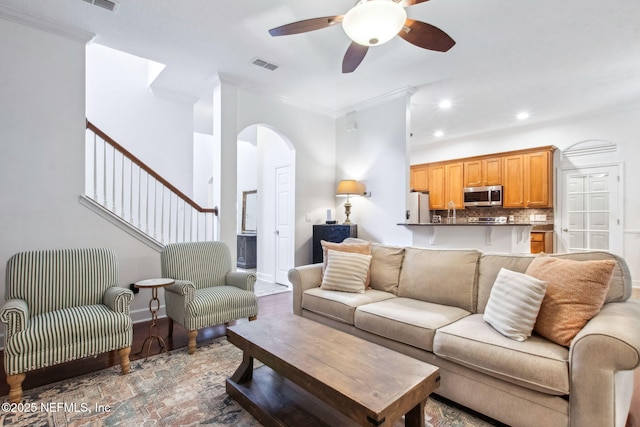 85488 Sagaponack Dr, Fernandina Beach, FL 32034 - living area featuring arched walkways, crown molding, recessed lighting, and a ceiling fan