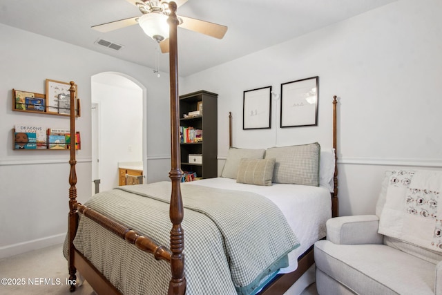 85488 Sagaponack Dr, Fernandina Beach, FL 32034 - carpeted bedroom with arched walkways and a ceiling fan