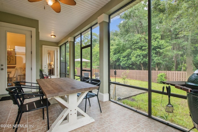 85488 Sagaponack Dr, Fernandina Beach, FL 32034 - sunroom featuring a ceiling fan and outdoor dining area