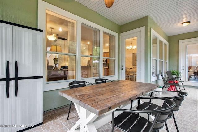 85488 Sagaponack Dr, Fernandina Beach, FL 32034 - sunroom featuring a chandelier