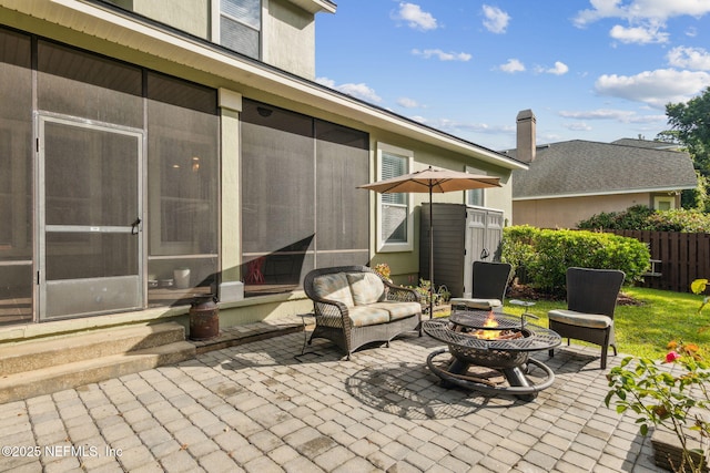 85488 Sagaponack Dr, Fernandina Beach, FL 32034 - view of patio featuring a fire pit and a sunroom