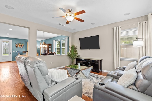 4749 Creek Bluff Ln, Middleburg, FL 32068 - living room with a chandelier, plenty of natural light, ceiling fan, and hardwood / wood-style flooring