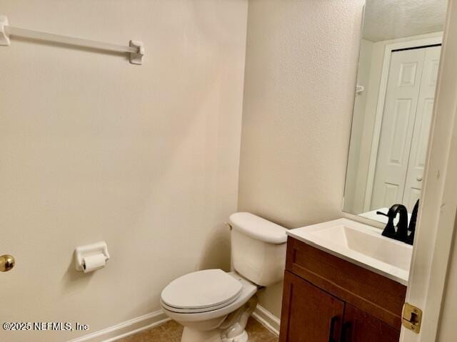 1810 Green Springs Cir Unit B, Fleming Island, FL 32003 - half bath with vanity, tile patterned flooring, and a textured ceiling