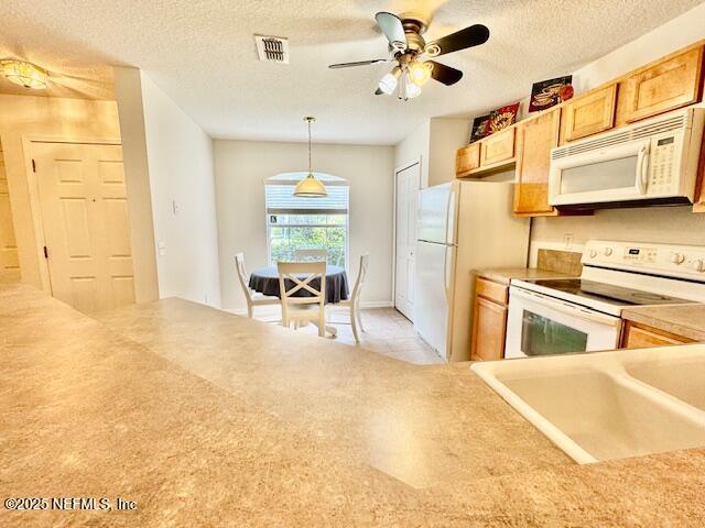 1810 Green Springs Cir Unit B, Fleming Island, FL 32003 - kitchen featuring white appliances, ceiling fan, a textured ceiling, light countertops, and pendant lighting