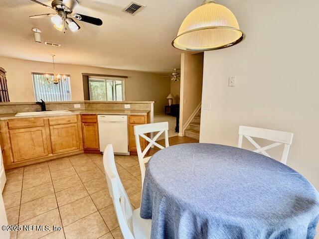 1810 Green Springs Cir Unit B, Fleming Island, FL 32003 - dining space featuring a ceiling fan, a chandelier, light tile patterned flooring, and stairway