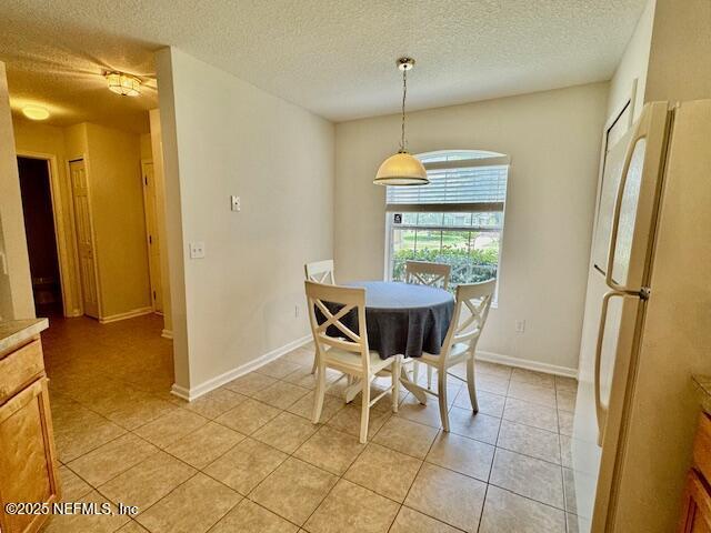 1810 Green Springs Cir Unit B, Fleming Island, FL 32003 - dining space featuring a textured ceiling and light tile patterned floors