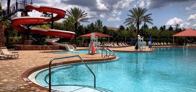 1810 Green Springs Cir Unit B, Fleming Island, FL 32003 - community pool featuring a water slide and a patio area