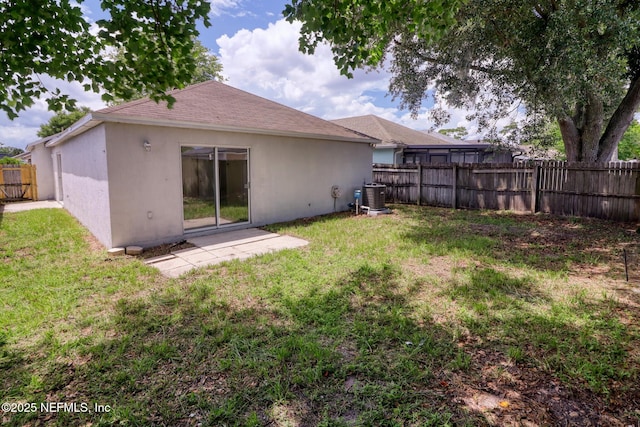 3371 Net Ct, Jacksonville, FL 32277 - rear view of house featuring a fenced backyard, stucco siding, and a shingled roof