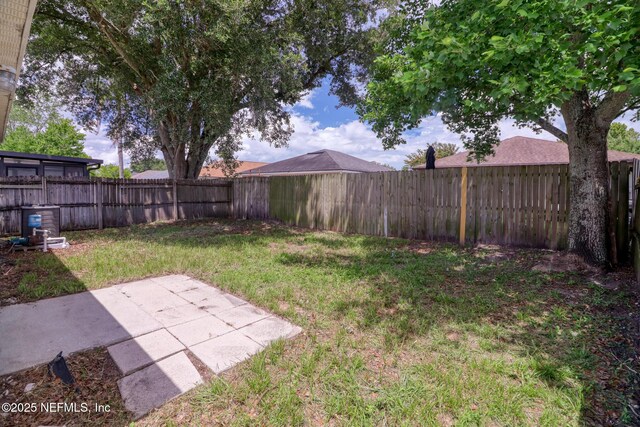 3371 Net Ct, Jacksonville, FL 32277 - fenced backyard with a patio
