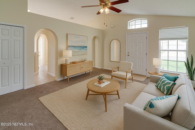 3371 Net Ct, Jacksonville, FL 32277 - living area featuring arched walkways, light colored carpet, a ceiling fan, and vaulted ceiling