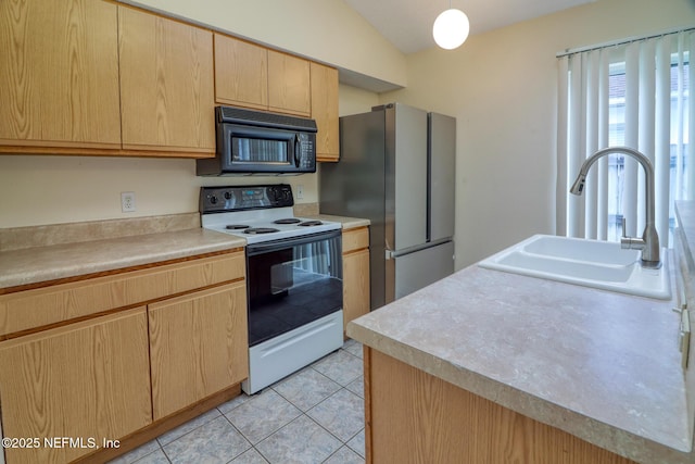 3371 Net Ct, Jacksonville, FL 32277 - kitchen featuring black microwave, electric range, light brown cabinets, freestanding refrigerator, and light tile patterned flooring