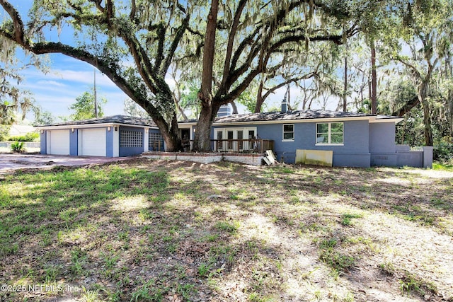 10268 Lake View Rd W, Jacksonville, FL 32225 - ranch-style house featuring a wooden deck, a garage, crawl space, and driveway