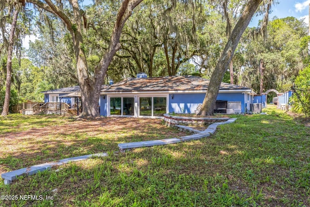 10268 Lake View Rd W, Jacksonville, FL 32225 - view of front of house with a wooden deck and a front yard