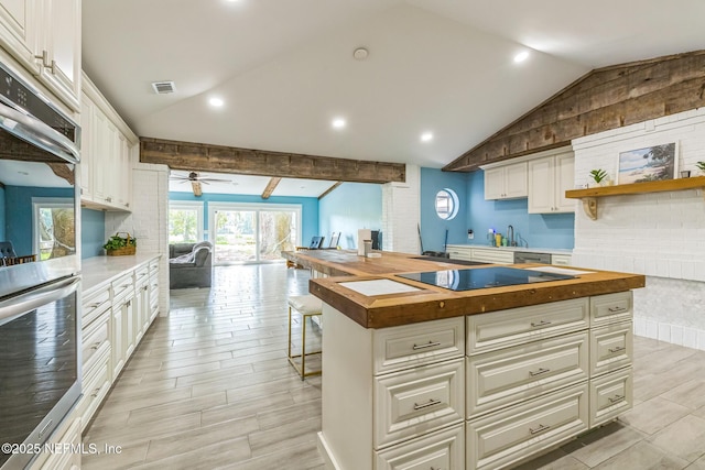 10268 Lake View Rd W, Jacksonville, FL 32225 - kitchen featuring wood counters, lofted ceiling, ceiling fan, stainless steel appliances, and open floor plan