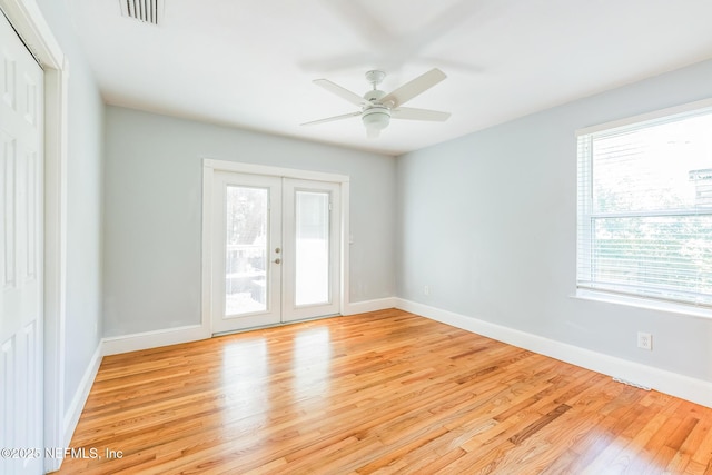 10268 Lake View Rd W, Jacksonville, FL 32225 - spare room featuring plenty of natural light, french doors, and light wood-style floors