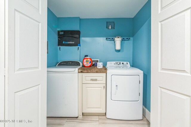 10268 Lake View Rd W, Jacksonville, FL 32225 - washroom with cabinet space and washing machine and clothes dryer