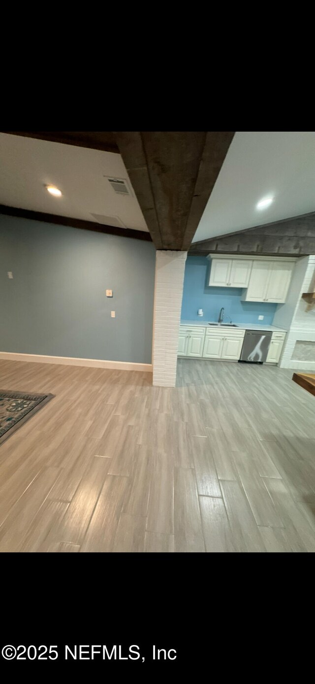 10268 Lake View Rd W, Jacksonville, FL 32225 - unfurnished living room with light wood-style floors and a sink