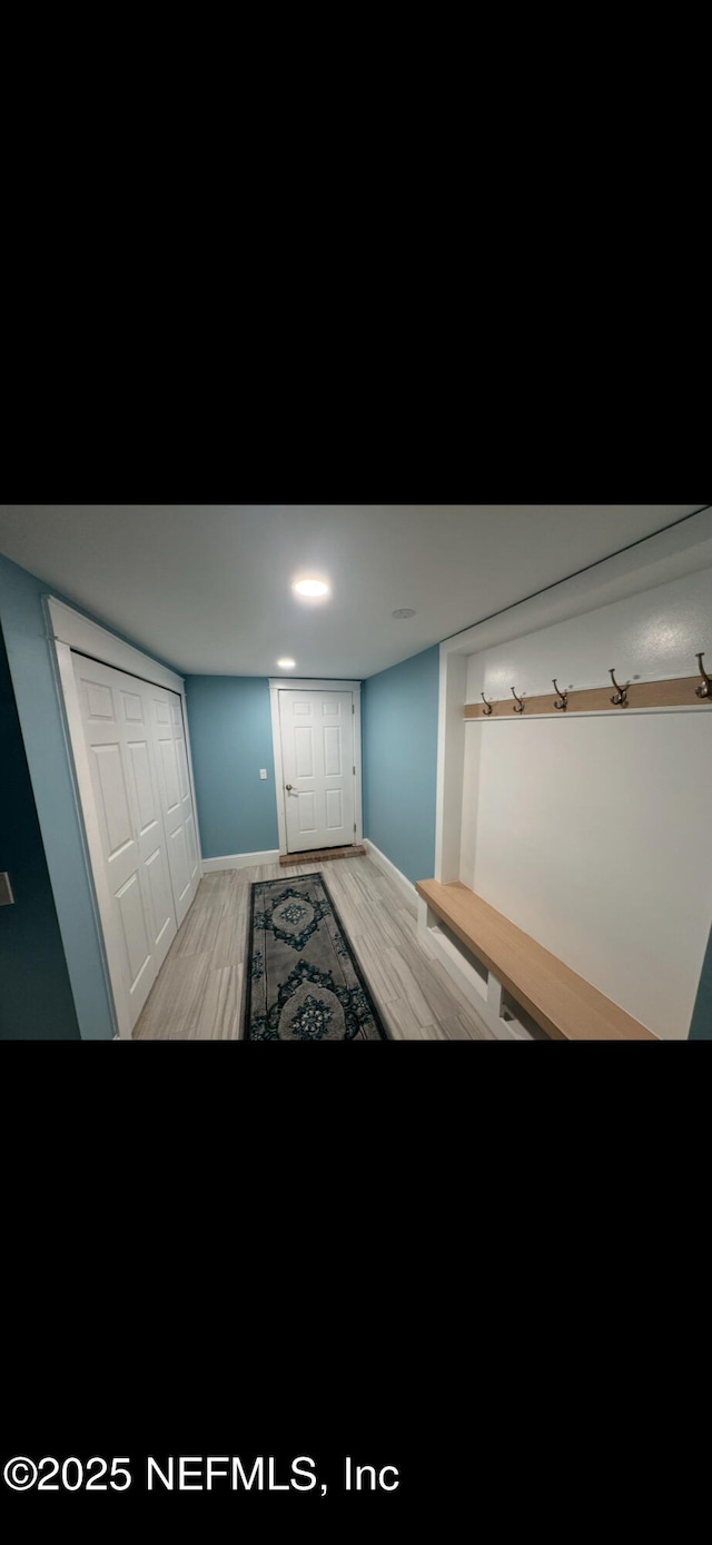10268 Lake View Rd W, Jacksonville, FL 32225 - unfurnished bedroom with light wood finished floors and a closet