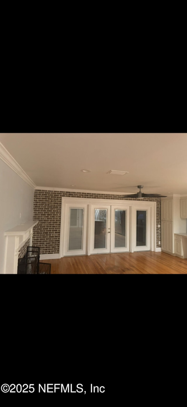 10268 Lake View Rd W, Jacksonville, FL 32225 - detailed view of crown molding, wood finished floors, and a fireplace