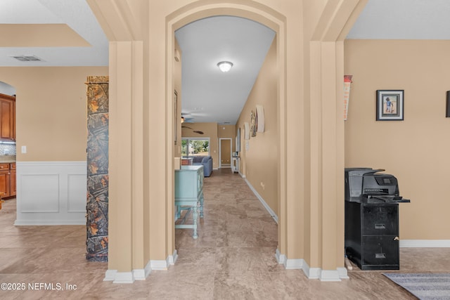 321 Palazzo Cir, Saint Augustine, FL 32092 - corridor with arched walkways and a wainscoted wall