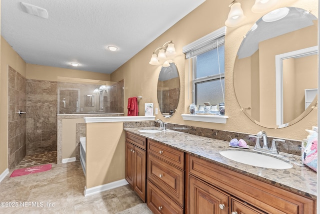 321 Palazzo Cir, Saint Augustine, FL 32092 - bathroom featuring double vanity, a walk in shower, and a textured ceiling
