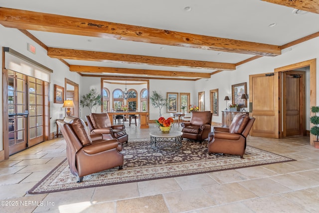 321 Palazzo Cir, Saint Augustine, FL 32092 - living area with french doors, beam ceiling, and stone tile flooring