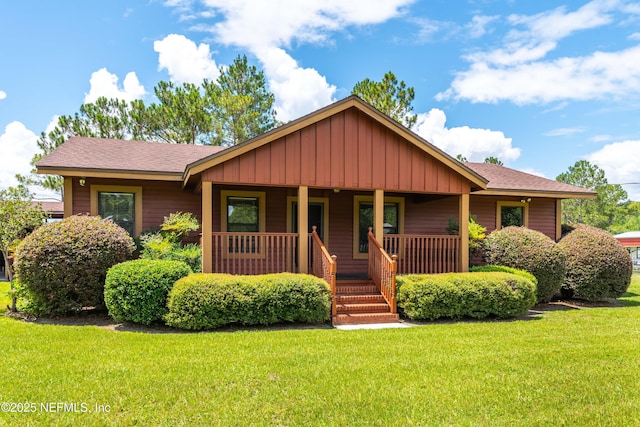 6032 Bob Kirkland Rd, Macclenny, FL 32063 - view of front of home featuring board and batten siding and a front yard
