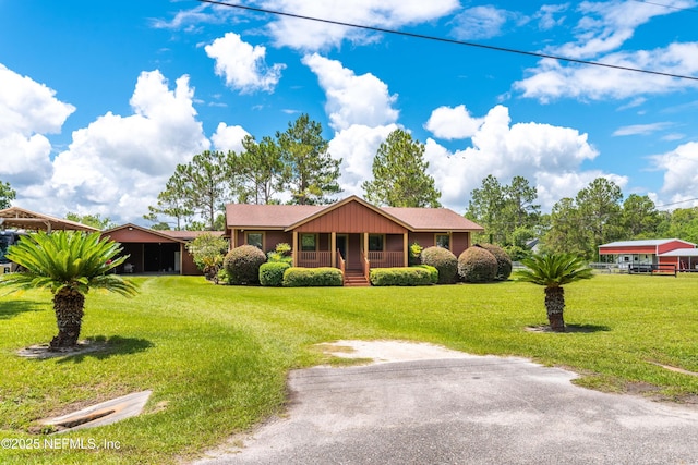 6032 Bob Kirkland Rd, Macclenny, FL 32063 - single story home featuring covered porch, a front yard, and a carport