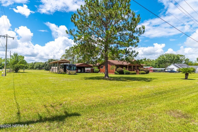 6032 Bob Kirkland Rd, Macclenny, FL 32063 - view of green lawn featuring a carport