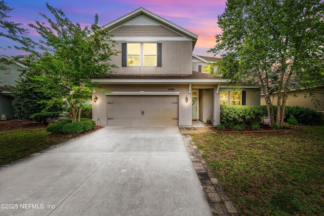 3299 Hidden Meadows Ct, Green Cove Springs, FL 32043 - traditional-style house with stucco siding, driveway, and an attached garage