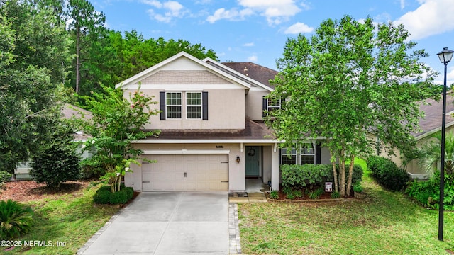 3299 Hidden Meadows Ct, Green Cove Springs, FL 32043 - traditional-style home featuring stucco siding, an attached garage, driveway, roof with shingles, and a front lawn
