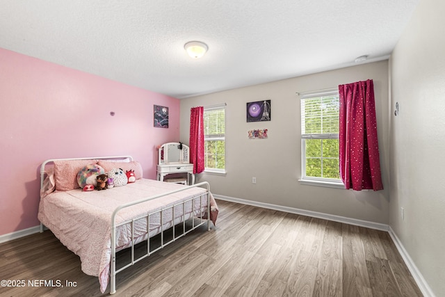 3299 Hidden Meadows Ct, Green Cove Springs, FL 32043 - bedroom featuring wood finished floors and a textured ceiling