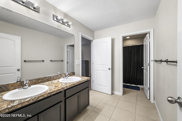 3299 Hidden Meadows Ct, Green Cove Springs, FL 32043 - full bathroom featuring double vanity, tile patterned flooring, a textured ceiling, and a shower with curtain