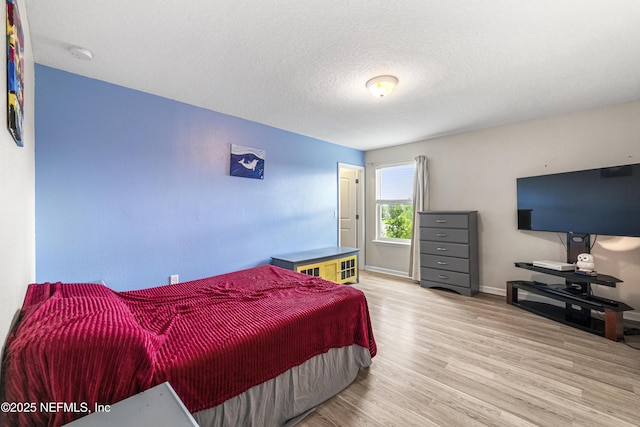 3299 Hidden Meadows Ct, Green Cove Springs, FL 32043 - bedroom with wood finished floors and a textured ceiling