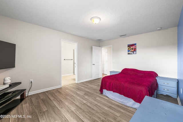 3299 Hidden Meadows Ct, Green Cove Springs, FL 32043 - bedroom with wood finished floors and a textured ceiling