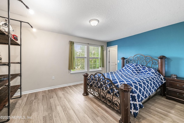 3299 Hidden Meadows Ct, Green Cove Springs, FL 32043 - bedroom with wood finished floors and a textured ceiling