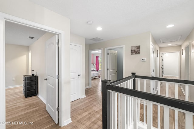 3299 Hidden Meadows Ct, Green Cove Springs, FL 32043 - hall with light wood finished floors, an upstairs landing, and recessed lighting