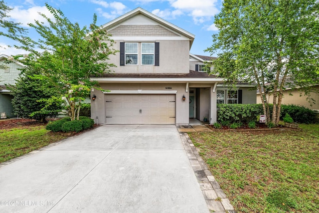 3299 Hidden Meadows Ct, Green Cove Springs, FL 32043 - view of front of house featuring stucco siding, concrete driveway, and a garage