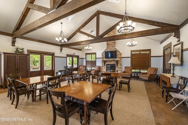 3299 Hidden Meadows Ct, Green Cove Springs, FL 32043 - dining room with beam ceiling, a fireplace, a chandelier, and high vaulted ceiling