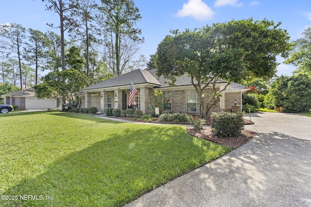 1565 Royal Fern Ln, Fleming Island, FL 32003 - single story home featuring a front lawn, driveway, brick siding, and roof with shingles