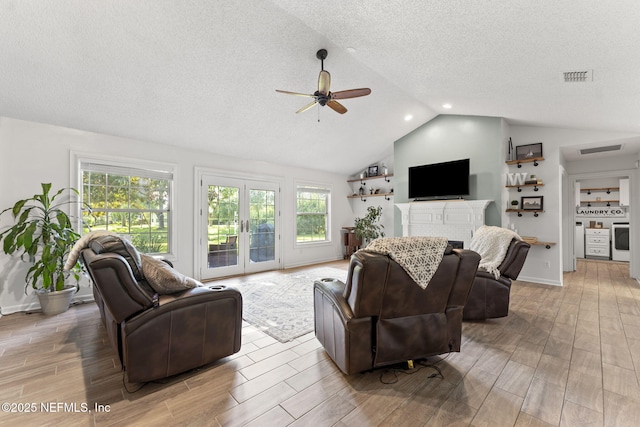 1565 Royal Fern Ln, Fleming Island, FL 32003 - living room with a ceiling fan, vaulted ceiling, wood finished floors, healthy amount of natural light, and a brick fireplace