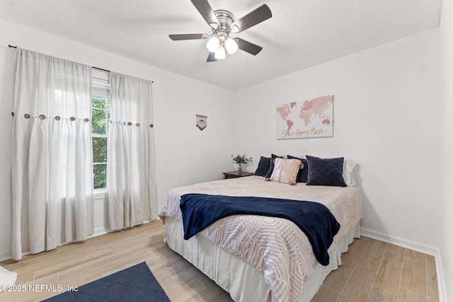 1565 Royal Fern Ln, Fleming Island, FL 32003 - bedroom with wood finished floors, a textured ceiling, and a ceiling fan