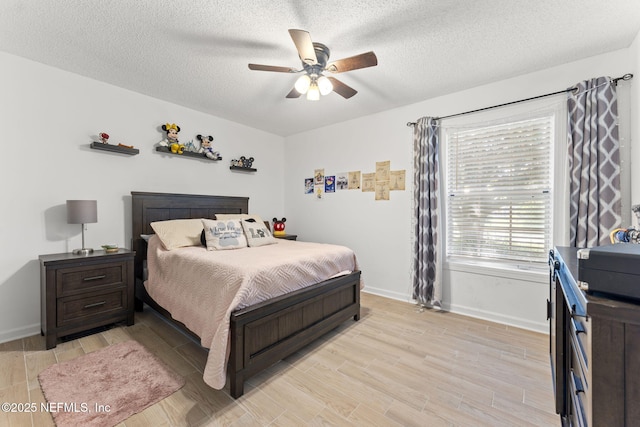 1565 Royal Fern Ln, Fleming Island, FL 32003 - bedroom featuring light wood finished floors, a textured ceiling, and ceiling fan