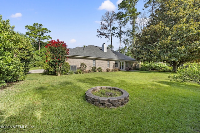 1565 Royal Fern Ln, Fleming Island, FL 32003 - view of grassy yard featuring an outdoor fire pit