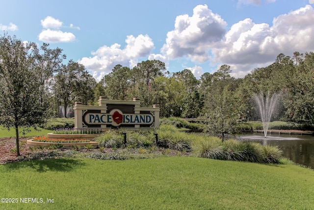 1565 Royal Fern Ln, Fleming Island, FL 32003 - community / neighborhood sign with a lawn and a water view