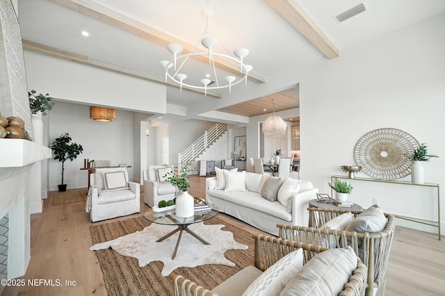 1509 Ocean Front, Neptune Beach, FL 32266 - living area with a chandelier, beam ceiling, wood finished floors, stairway, and recessed lighting