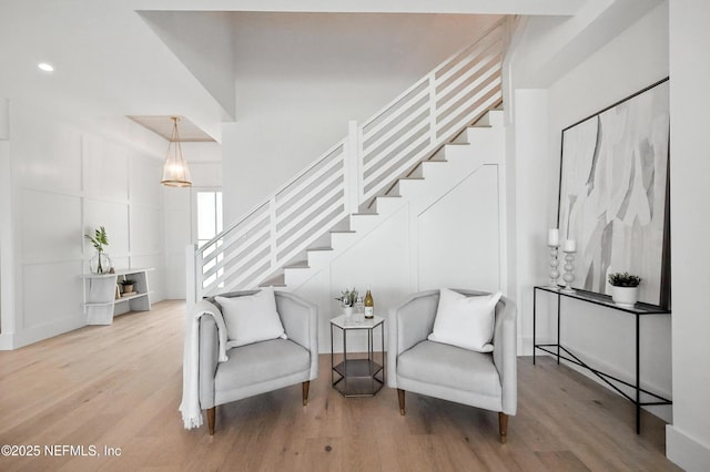 1509 Ocean Front, Neptune Beach, FL 32266 - sitting room with wood finished floors, stairway, and recessed lighting