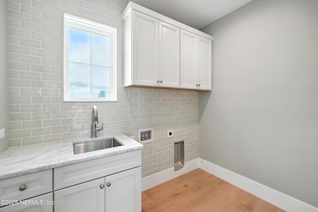 1509 Ocean Front, Neptune Beach, FL 32266 - laundry room featuring hookup for an electric dryer, hookup for a washing machine, cabinet space, and light wood-type flooring